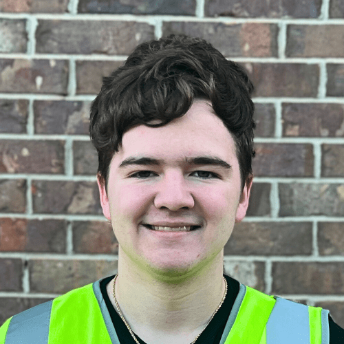 German Shepherd sitting in a clean yard after PF TakeAway™ poop haul-off service by Poop Free OKC.