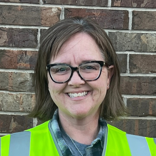 German Shepherd sitting in a clean yard after PF TakeAway™ poop haul-off service by Poop Free OKC.