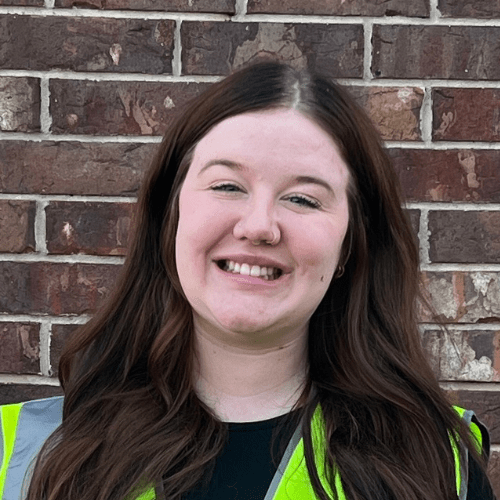 German Shepherd sitting in a clean yard after PF TakeAway™ poop haul-off service by Poop Free OKC.