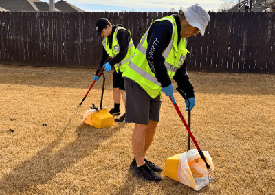 Professional dog poop removal service in Warr Acres, Oklahoma with Poop Free OKC Scoop Techs cleaning a residential backyard.