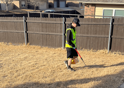 Poop Free OKC technician walking yard during dog poop cleanup.