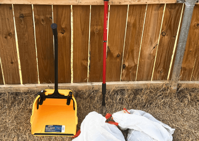 Dog poop removal tools and bagged waste used by Poop Free OKC.