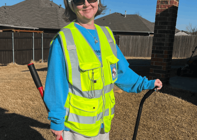 Poop Free OKC scoop technician performing professional pet waste removal service at a residential property in Oklahoma City.